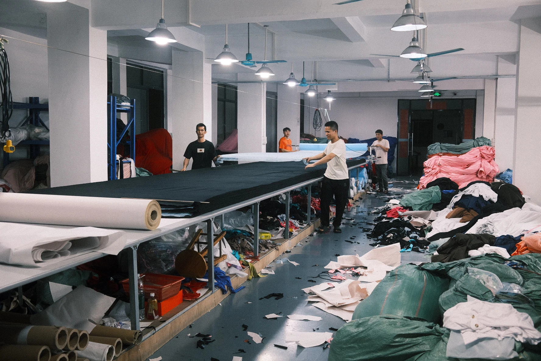 Blesstop team preparing fabric on the cutting floor