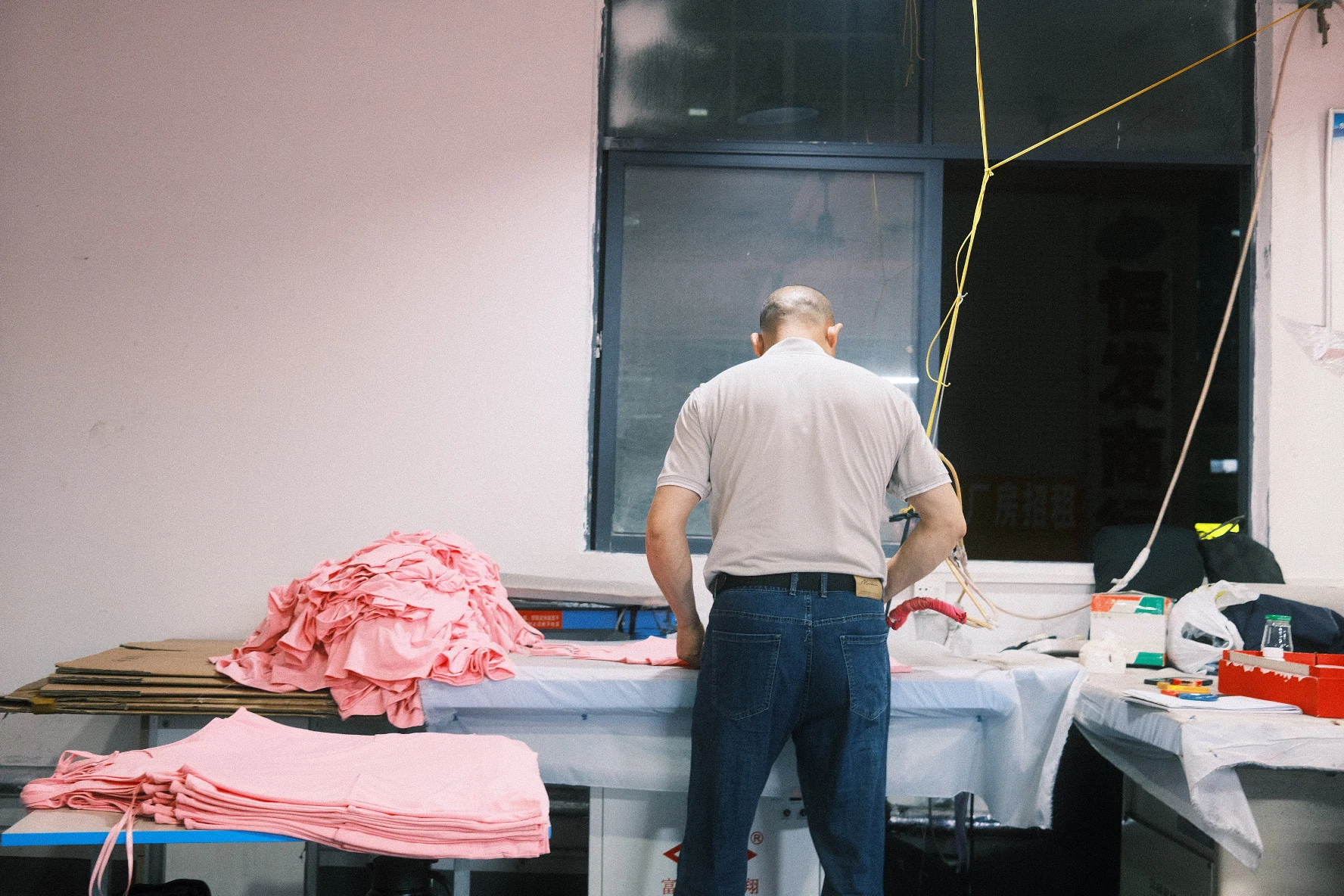 Blesstop worker completing garment finishing