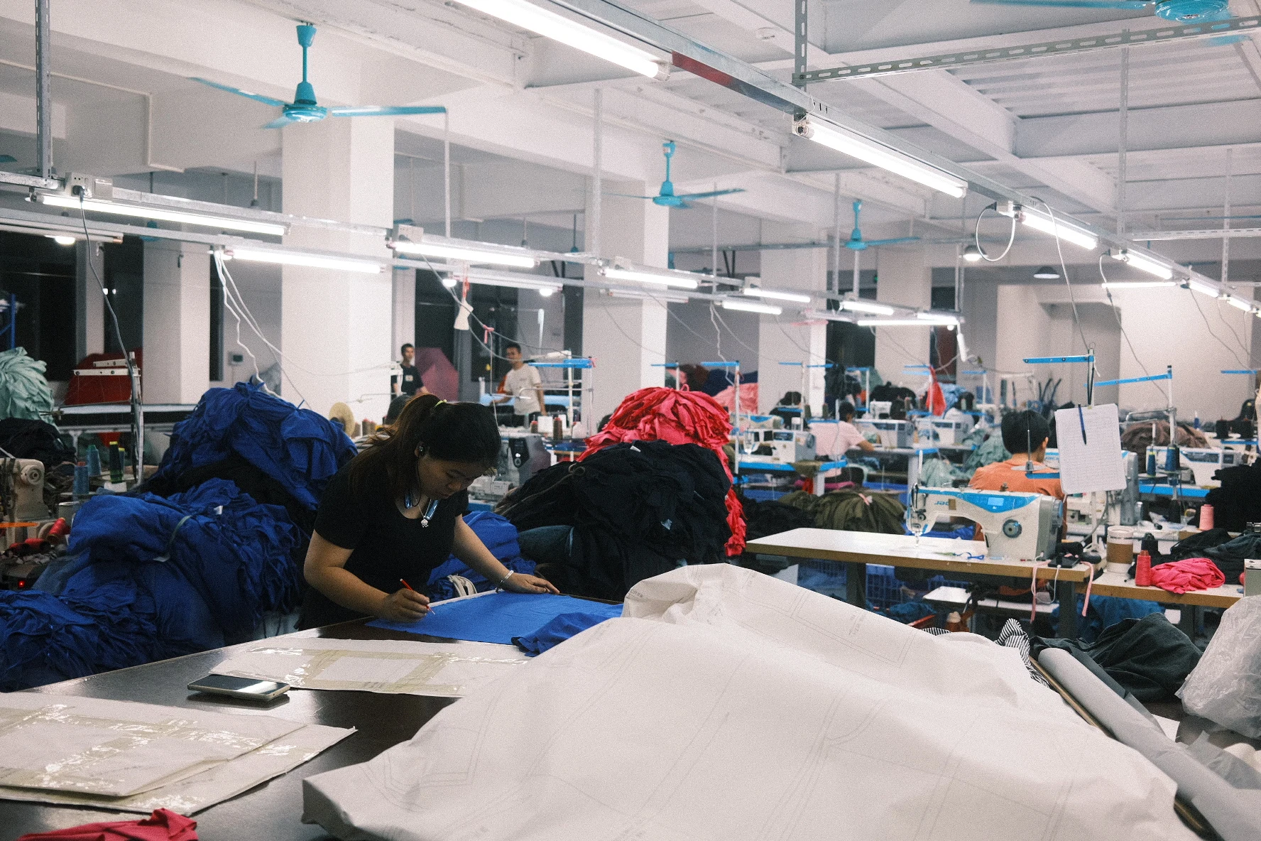 Blesstop team checking fabric patterns