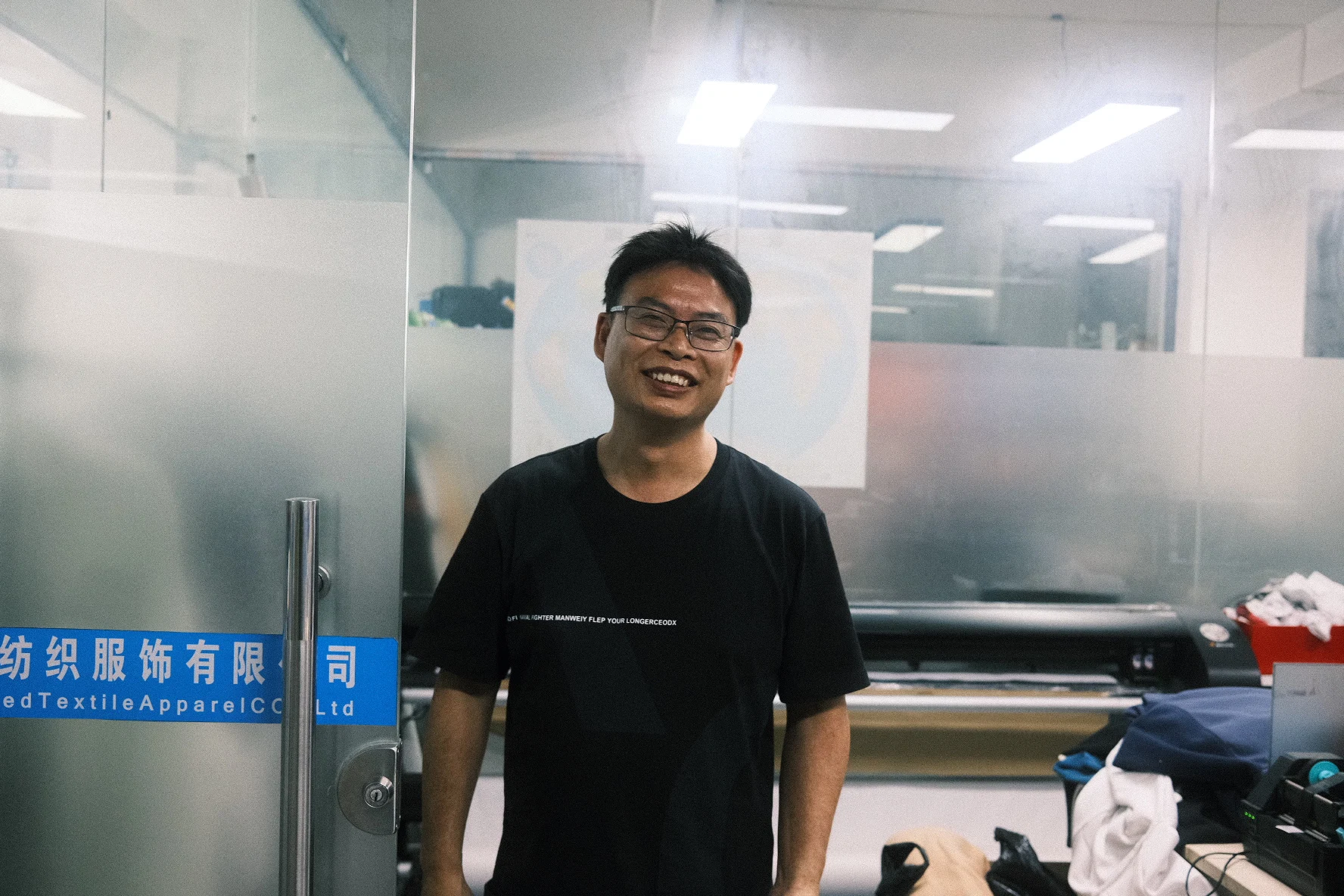 Smiling Blesstop team member in the development room
