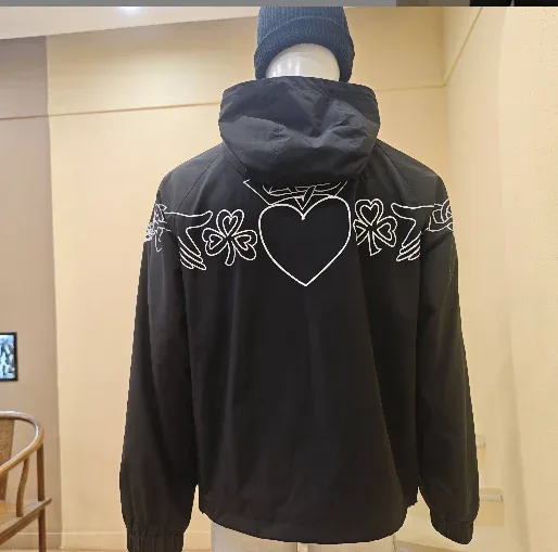 Black hooded jacket sample with upper-back artwork