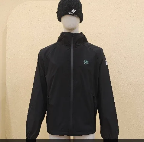 Front of the black hooded zip jacket sample with a small green chest motif