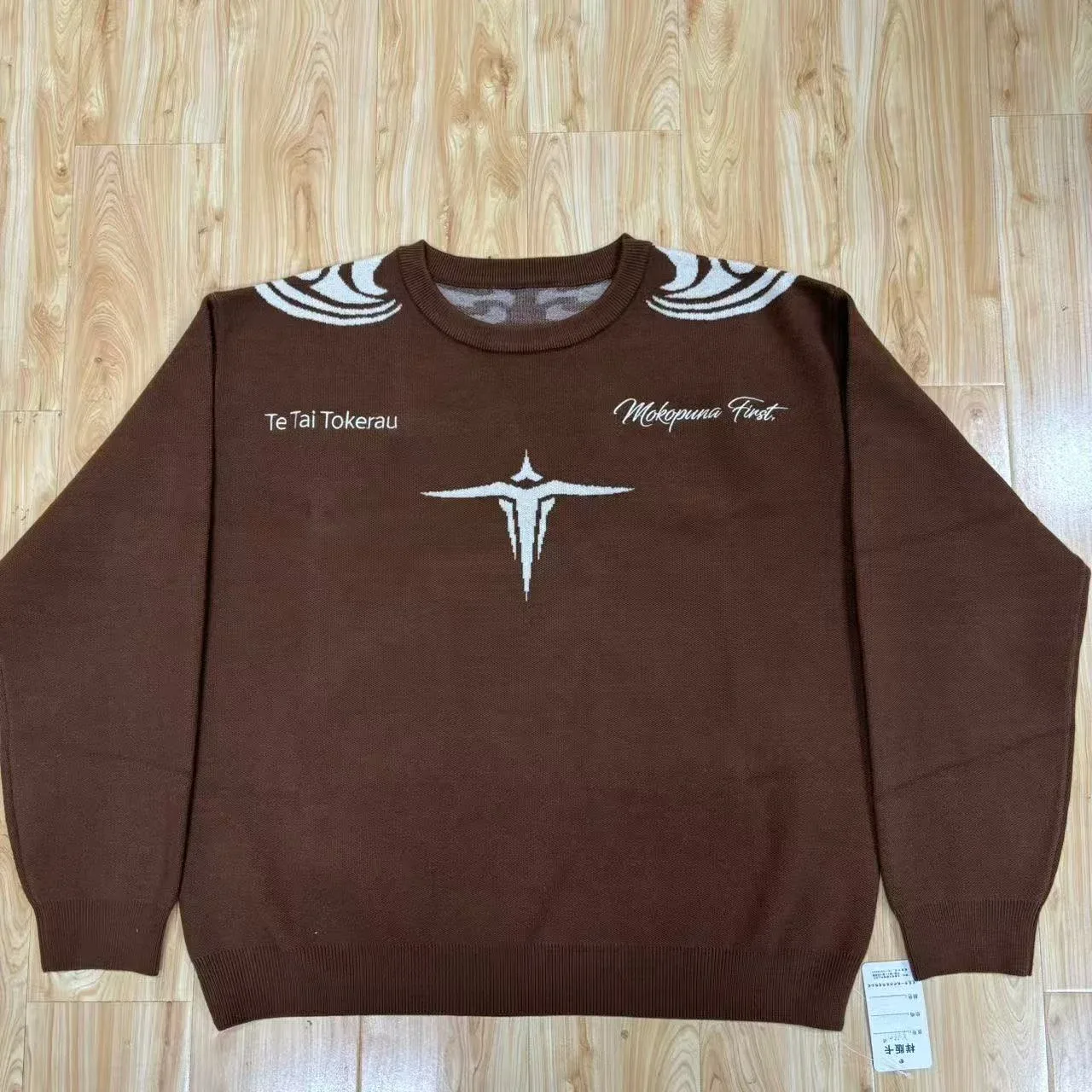 Brown jacquard knit sweater photographed during this customer project’s bulk review